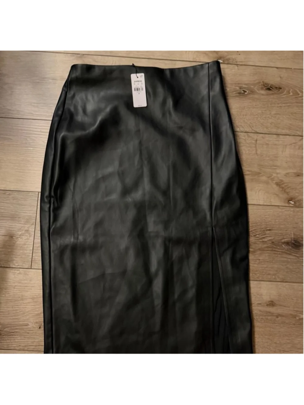 Black faux leather maxi skirt with a sleek longline silhouette